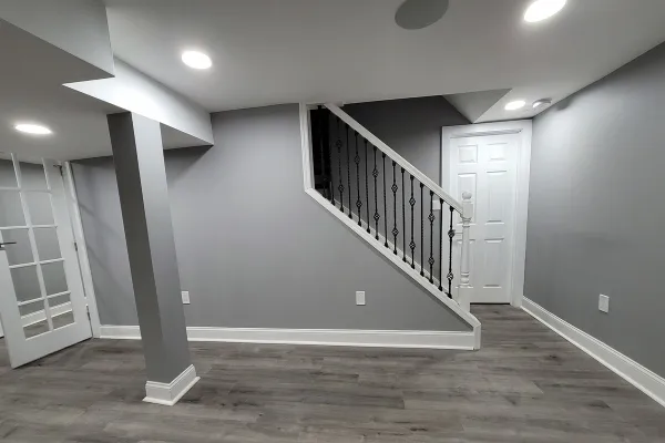 Basement black white stairs, vinyl flooring