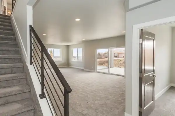 basement remodeling, stairs, carpet floor, wall color grey