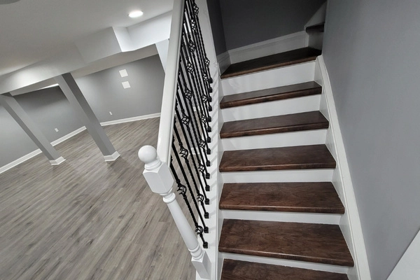 Basement finishing in Princeton with white finished stairs by lee home remodel