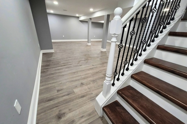 Basement finishing princeton with finished stairs and metal handrails by lee home remodel