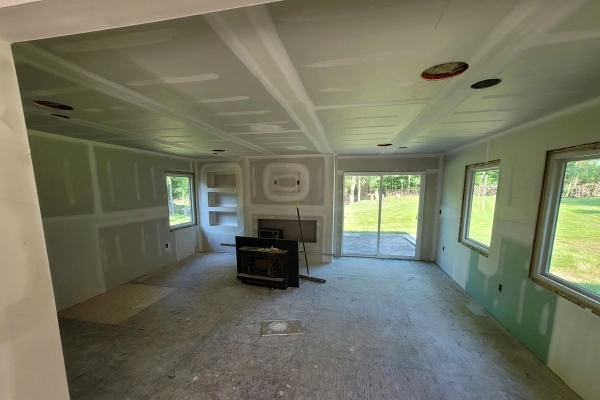 Applying drywall joint compound with precision.