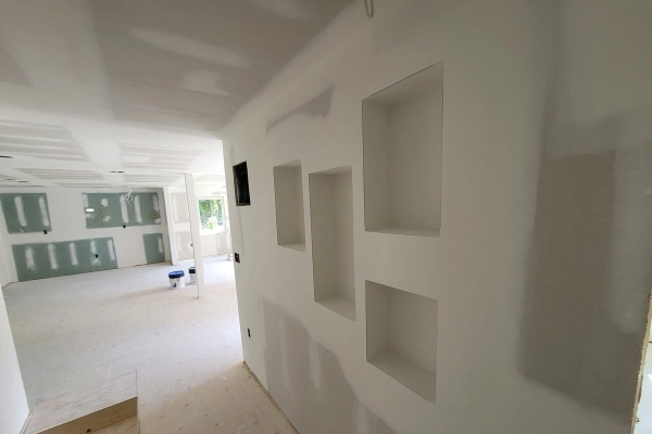 Drywall seam taping for flawless wall surfaces.