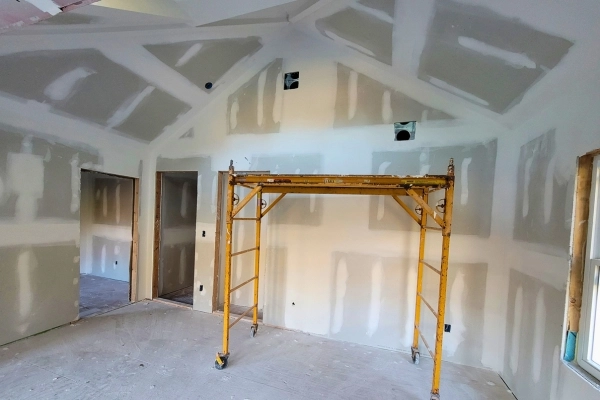 Drywall surface preparation before painting.