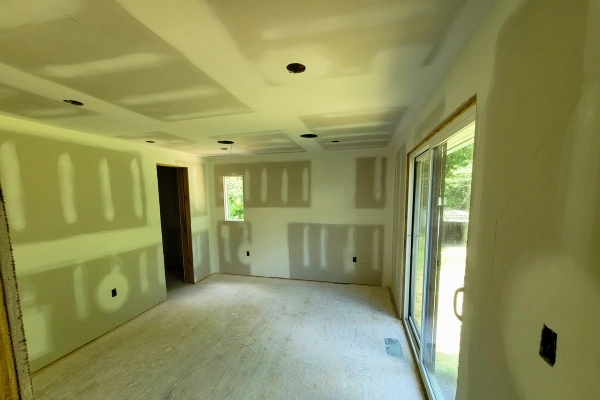 Professional drywall taping for seamless wall joints.
